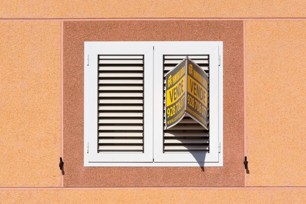 A bright storefront sign reading forsale highlights a discounted product display.