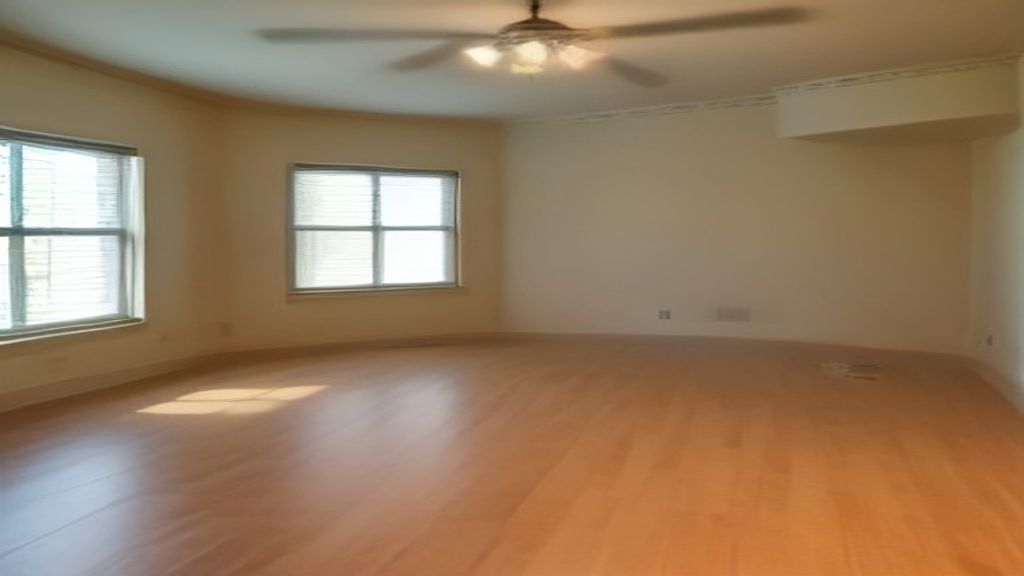 A family touring a spacious rent to own home with a for‑sale sign and moving boxes.